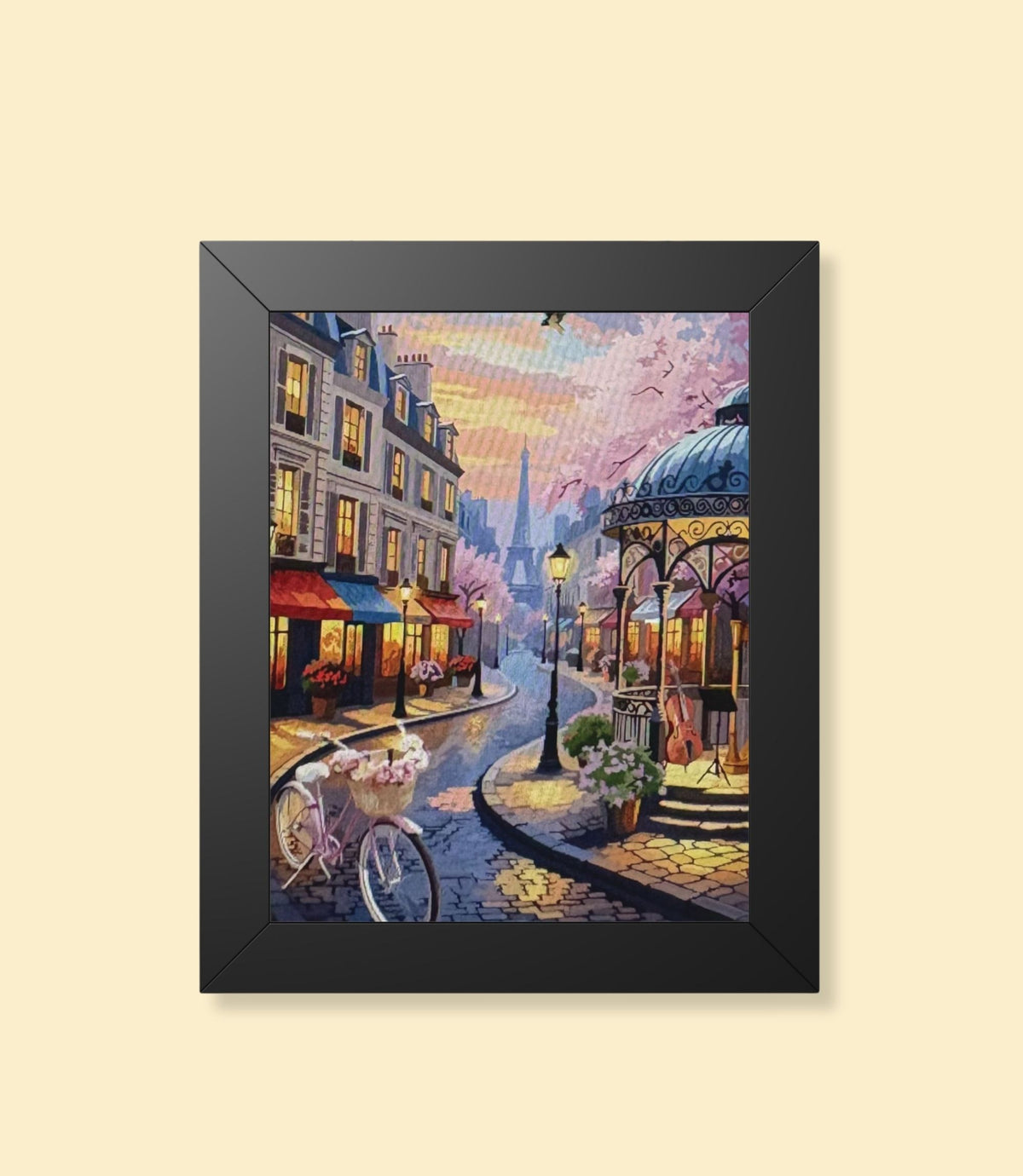 Paris street café framed poster with black frame on a cream background
