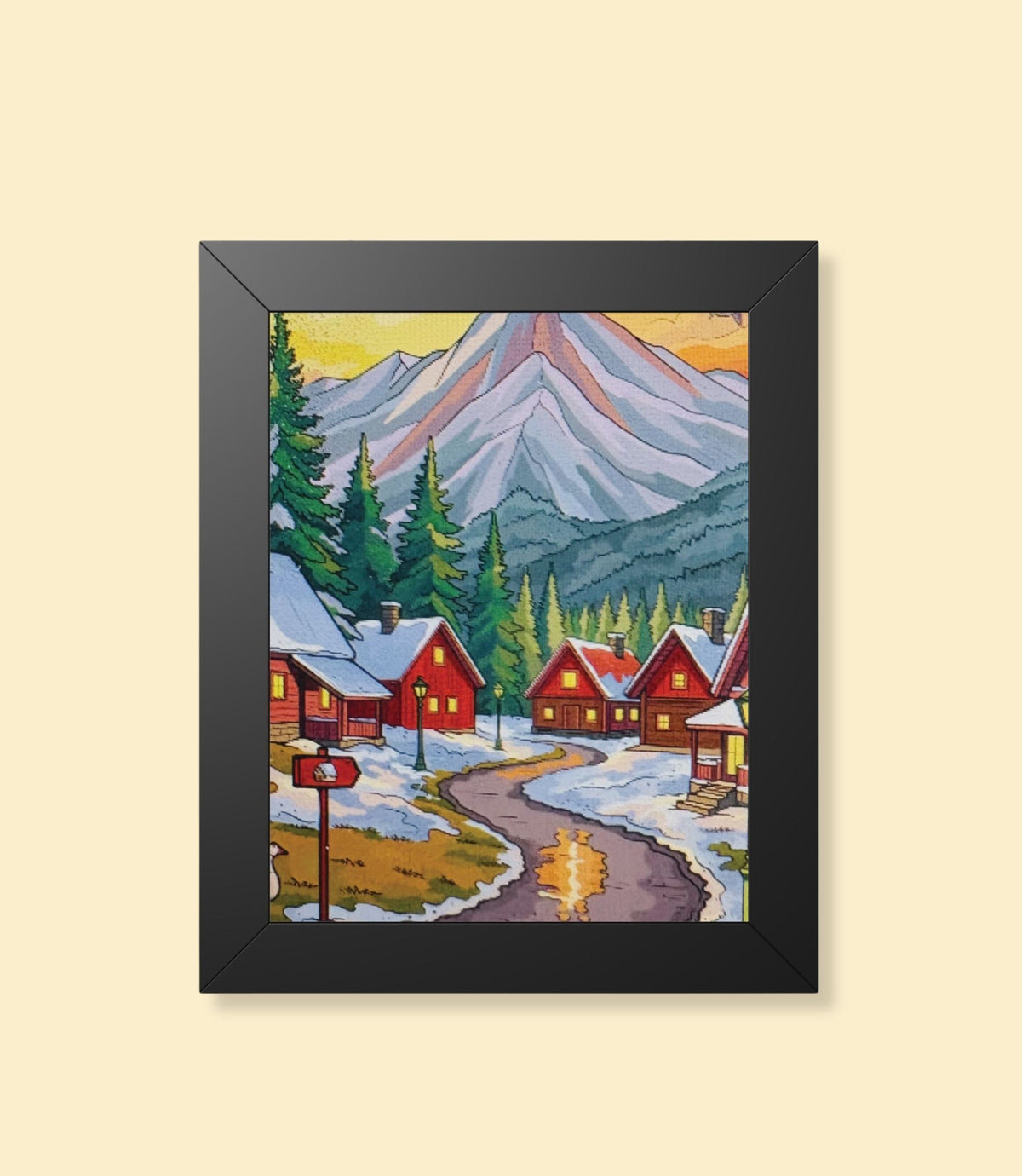 Winter mountain village framed poster with black frame on a cream background