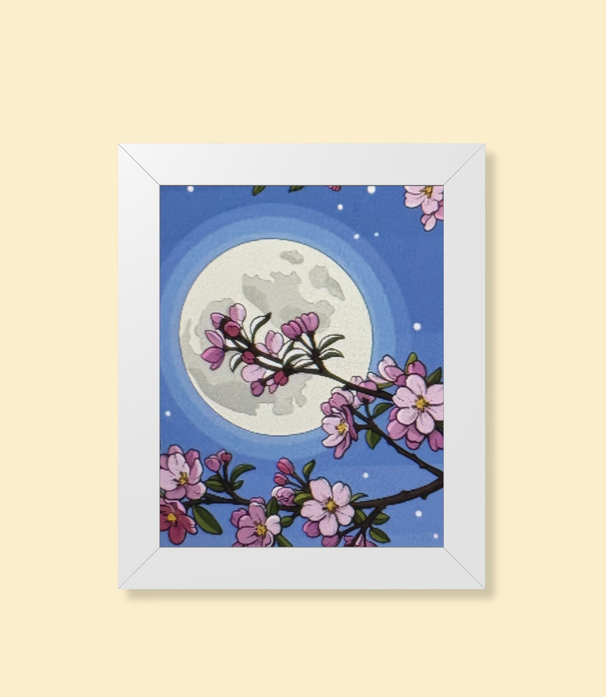 Cherry blossom moon framed poster with white frame on a cream background