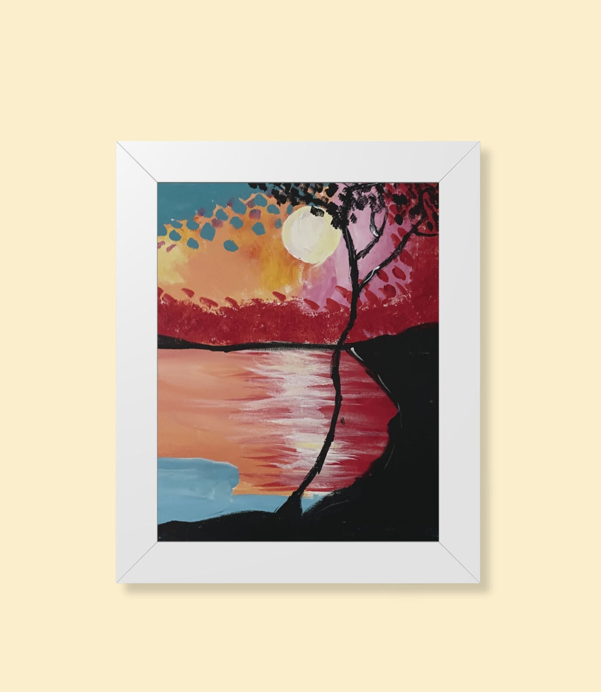 Sunset lake and silhouetted tree framed poster with white frame on a cream background