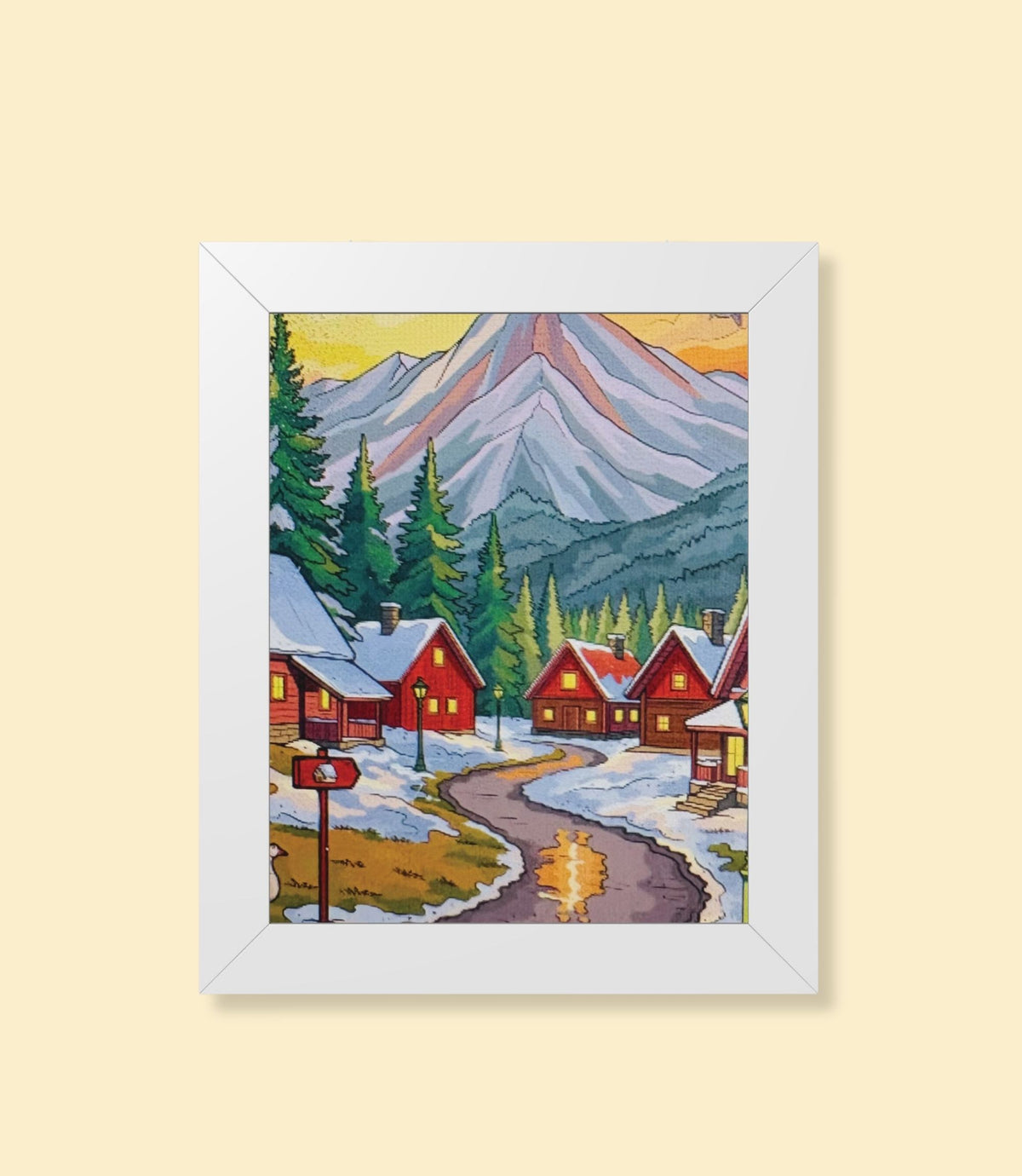 Winter mountain village framed poster with white frame on a cream background
