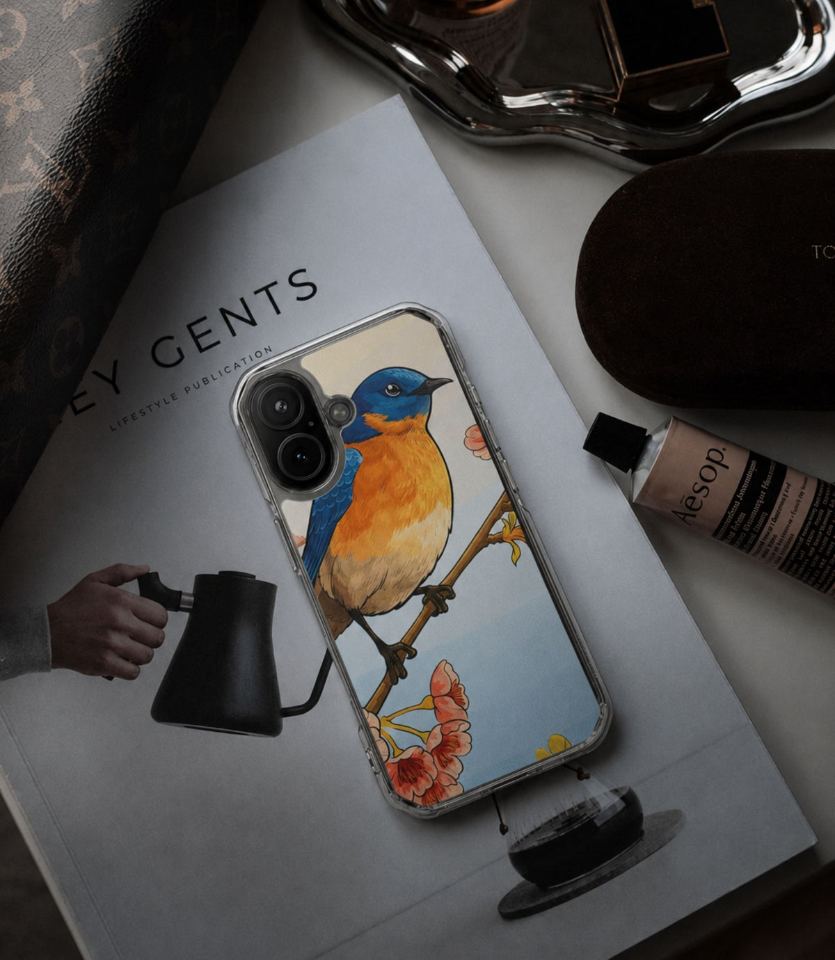 Bluebird and cherry blossoms clear phone case styled in an everyday lifestyle scene