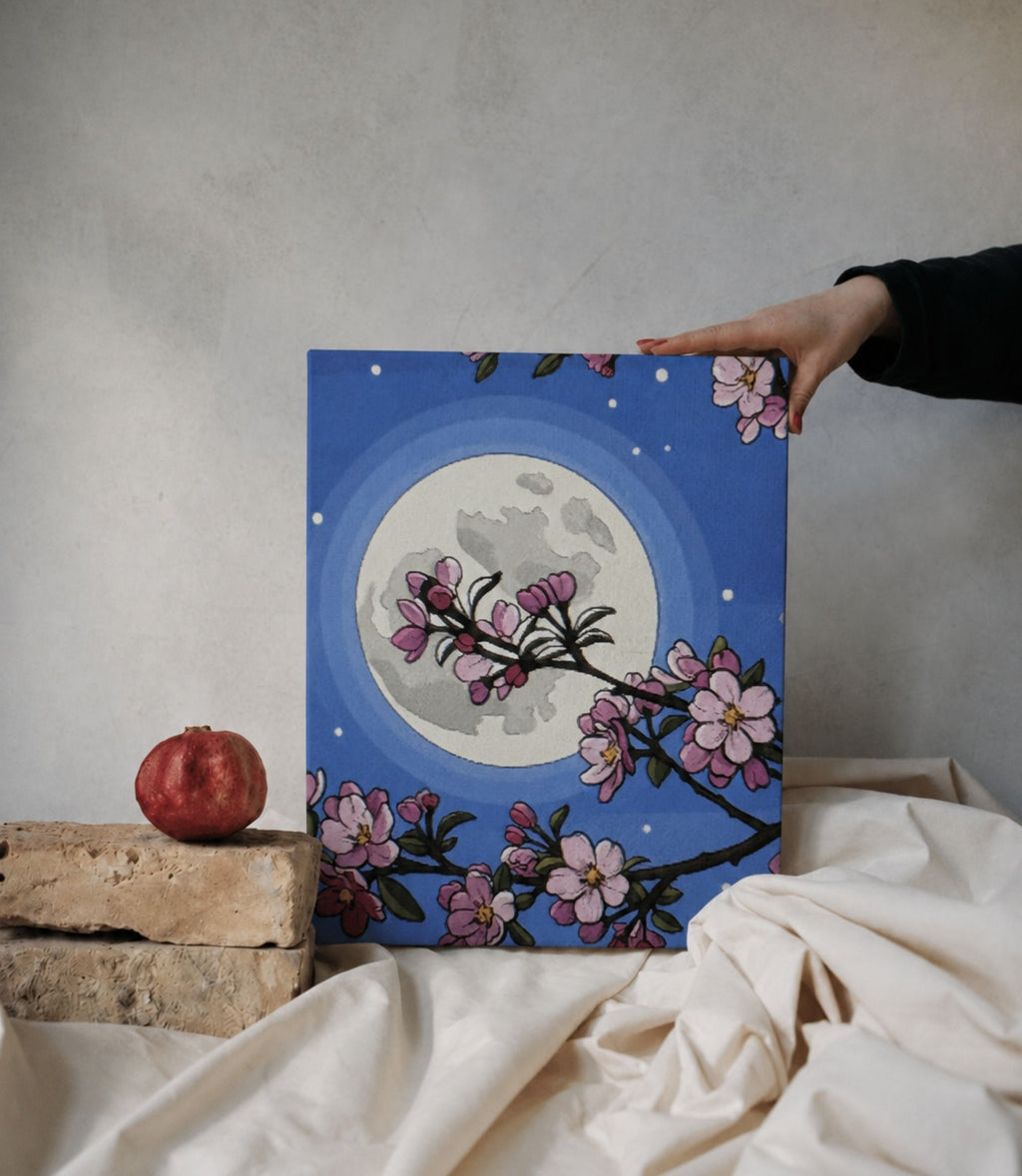 Person holding cherry blossom moon stretched canvas wall art