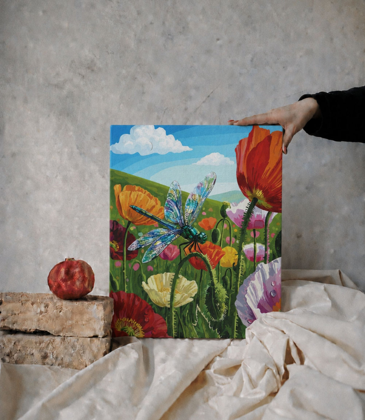 Person holding dragonfly meadow stretched canvas wall art