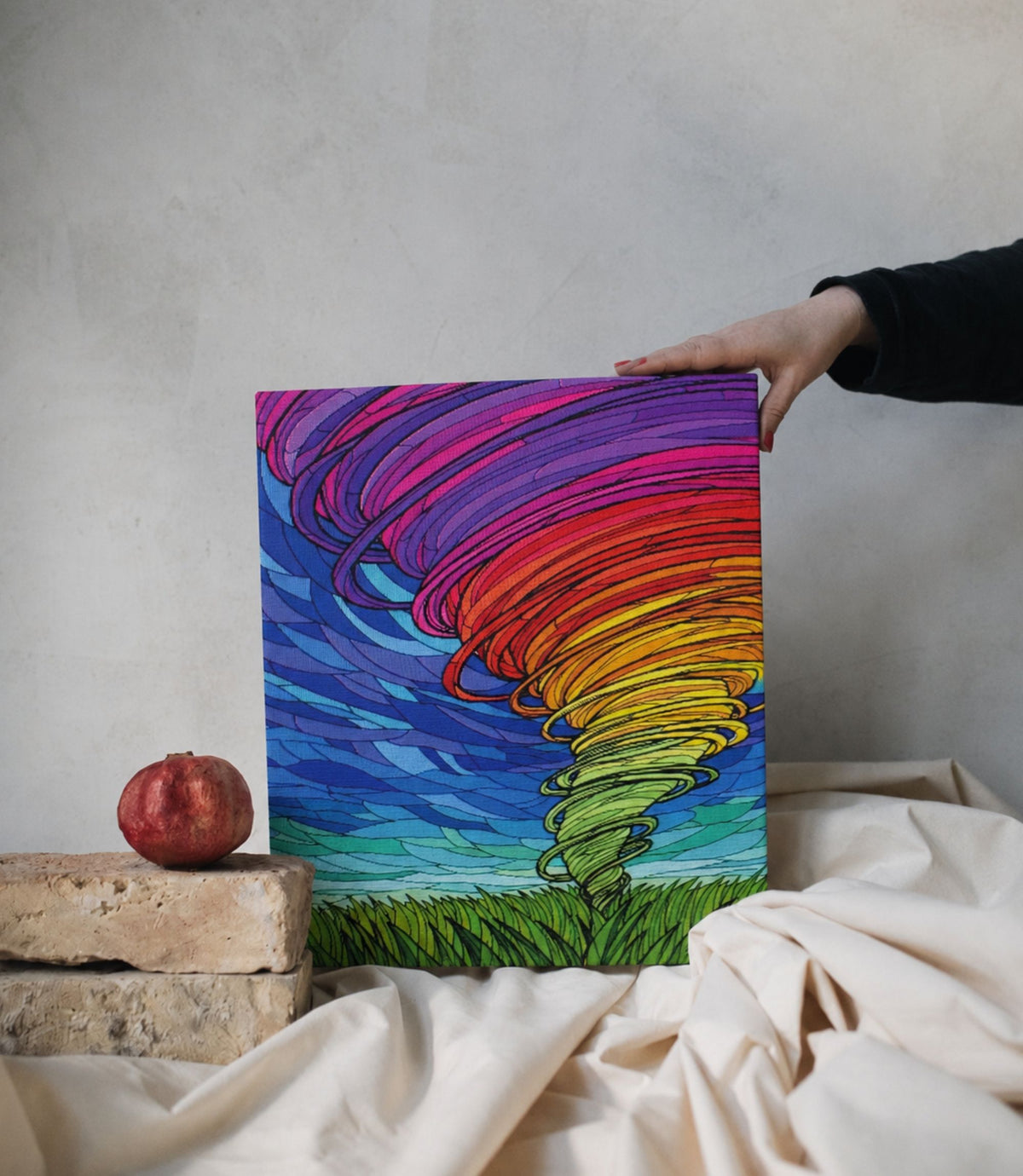 Person holding colourful rainbow tornado stretched canvas art