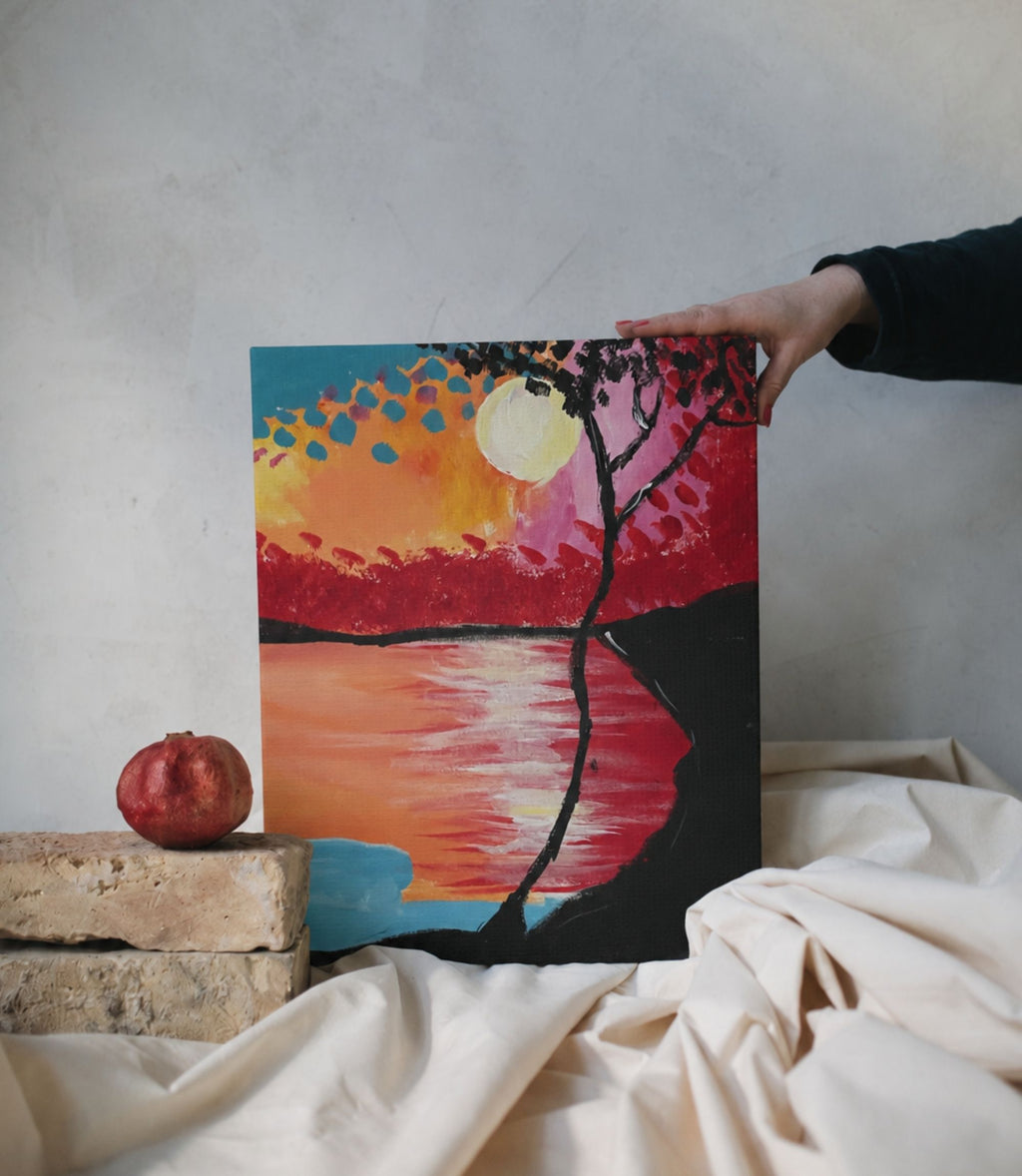 Person holding sunset lake and silhouetted tree stretched canvas wall art