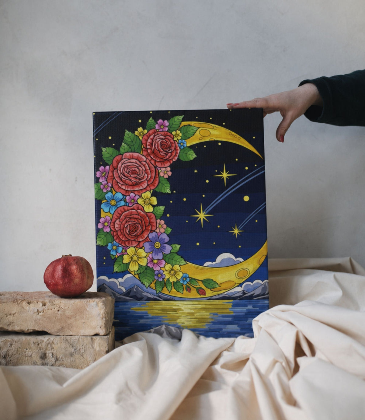 Person holding floral crescent moon stretched canvas wall art