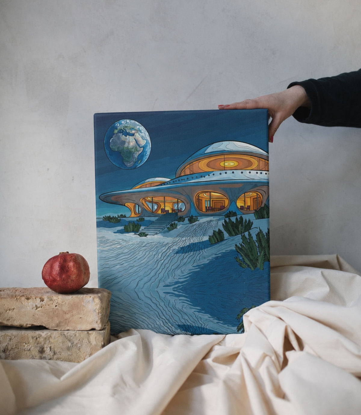 Person holding retro space house stretched canvas wall art
