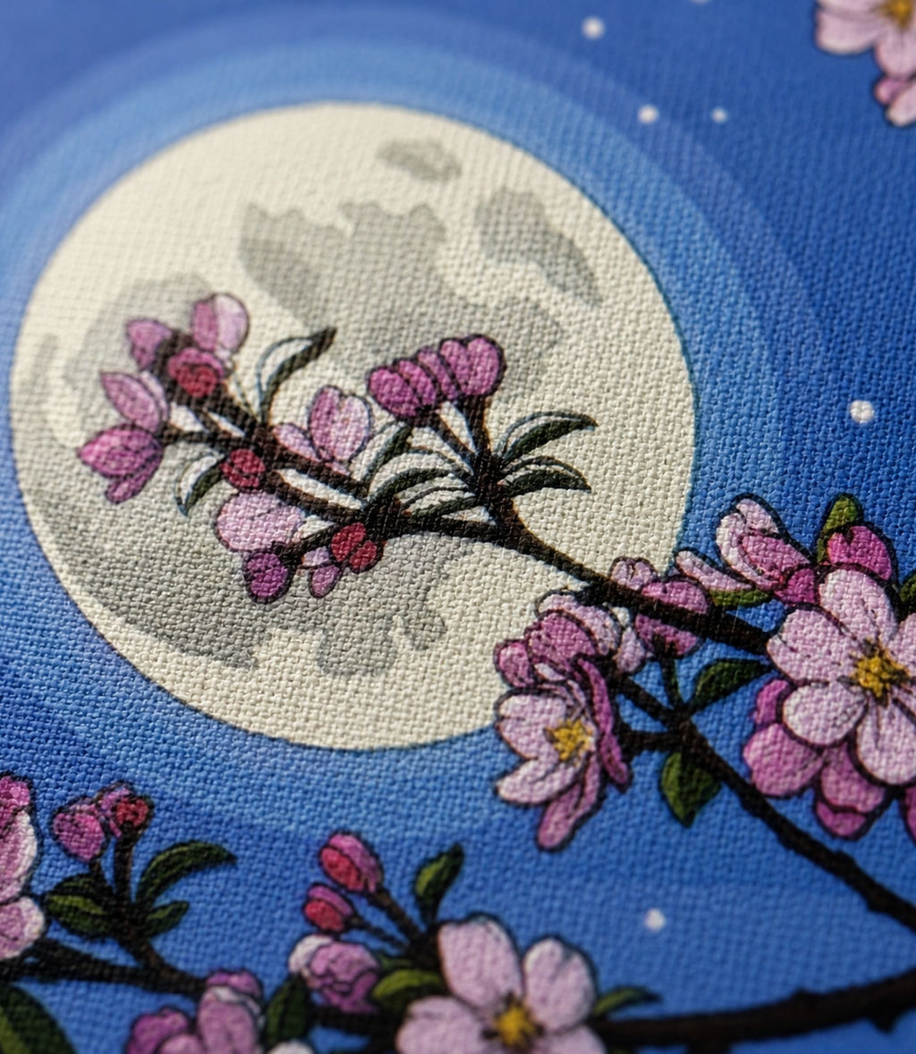 Close-up of cherry blossom moon artwork and matte canvas texture