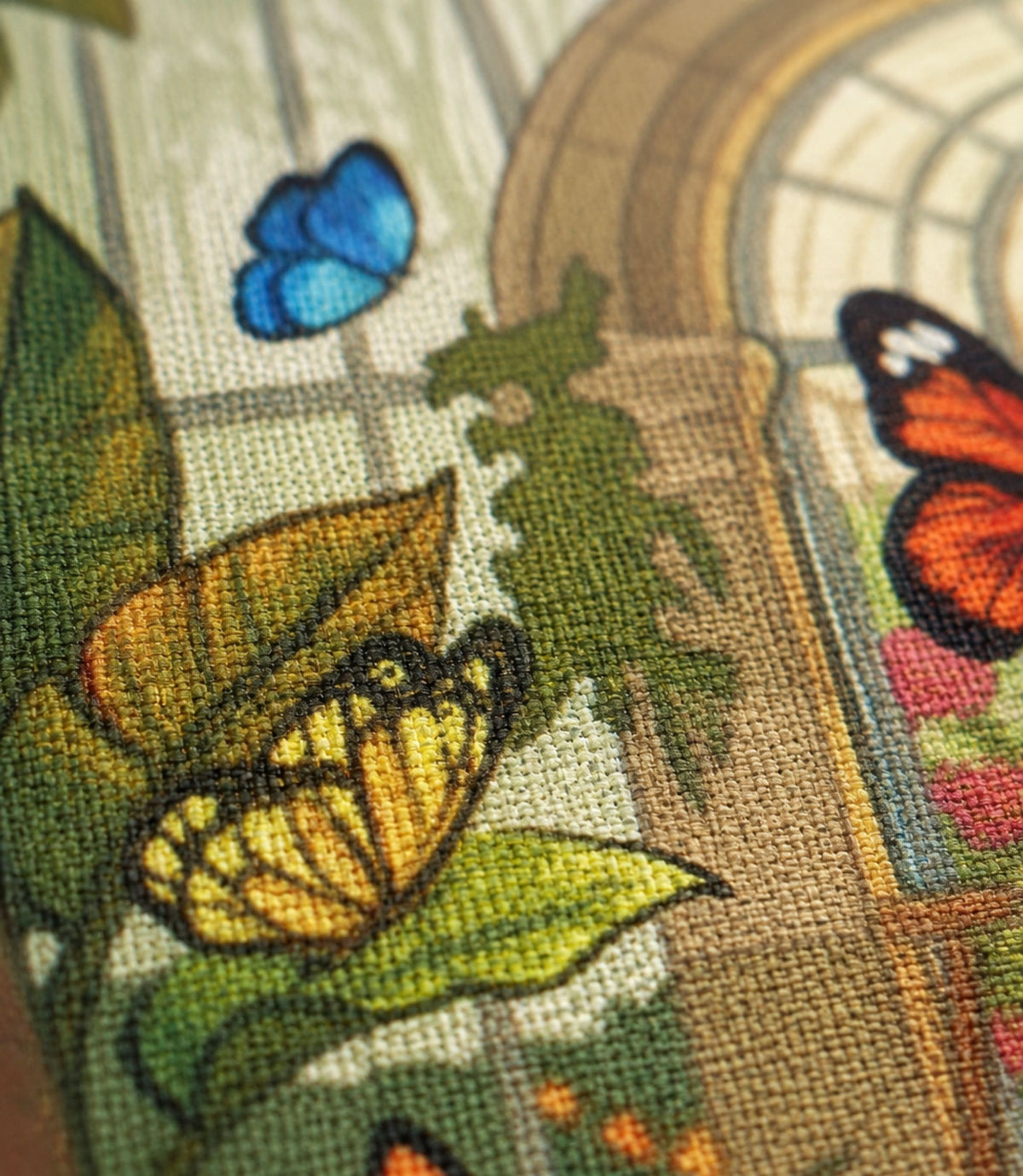 Close-up of butterfly conservatory artwork and matte canvas texture