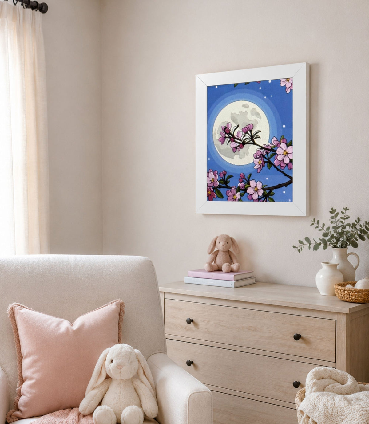 White-framed cherry blossom moon poster displayed in a modern interior