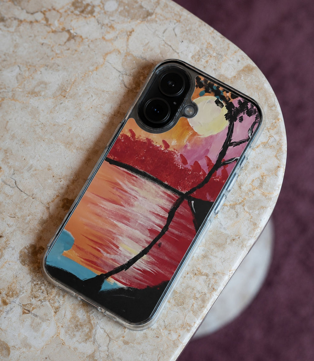 Sunset lake and silhouetted tree clear phone case styled in an everyday lifestyle scene