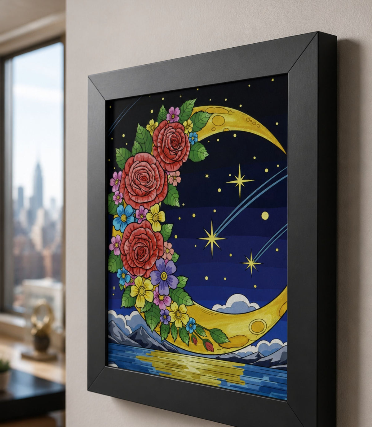 Close-up side view of black-framed floral crescent moon art print