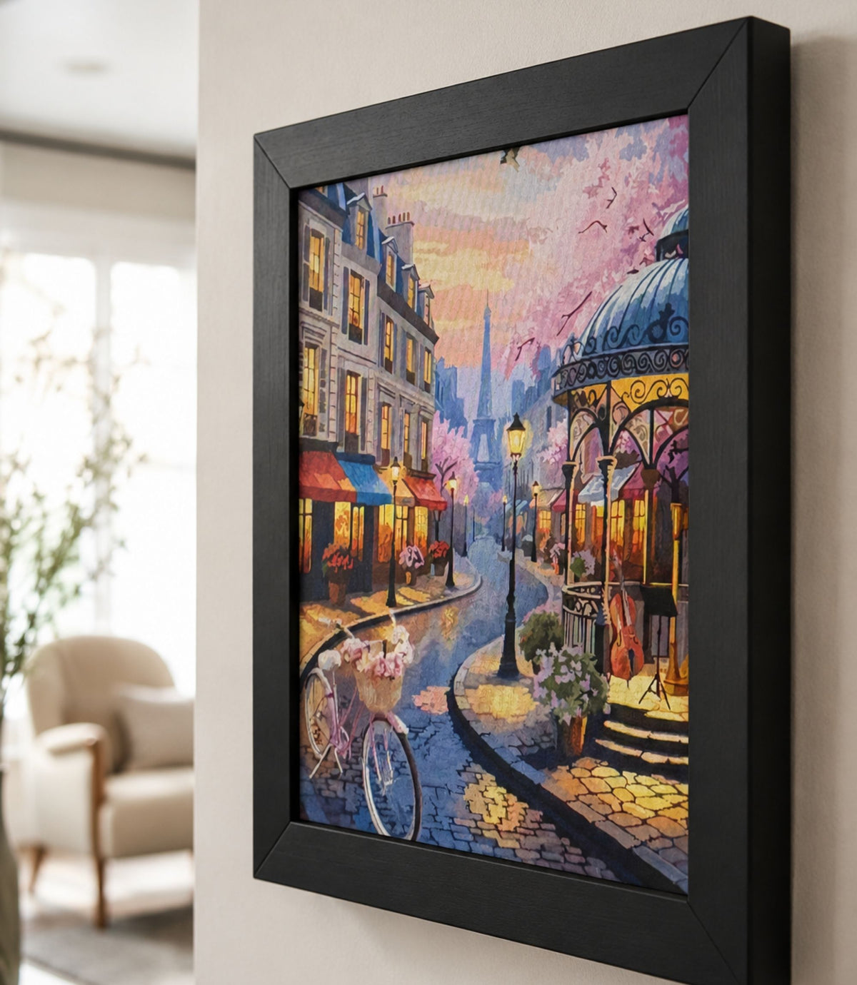 Close-up side view of black-framed Paris street café art print