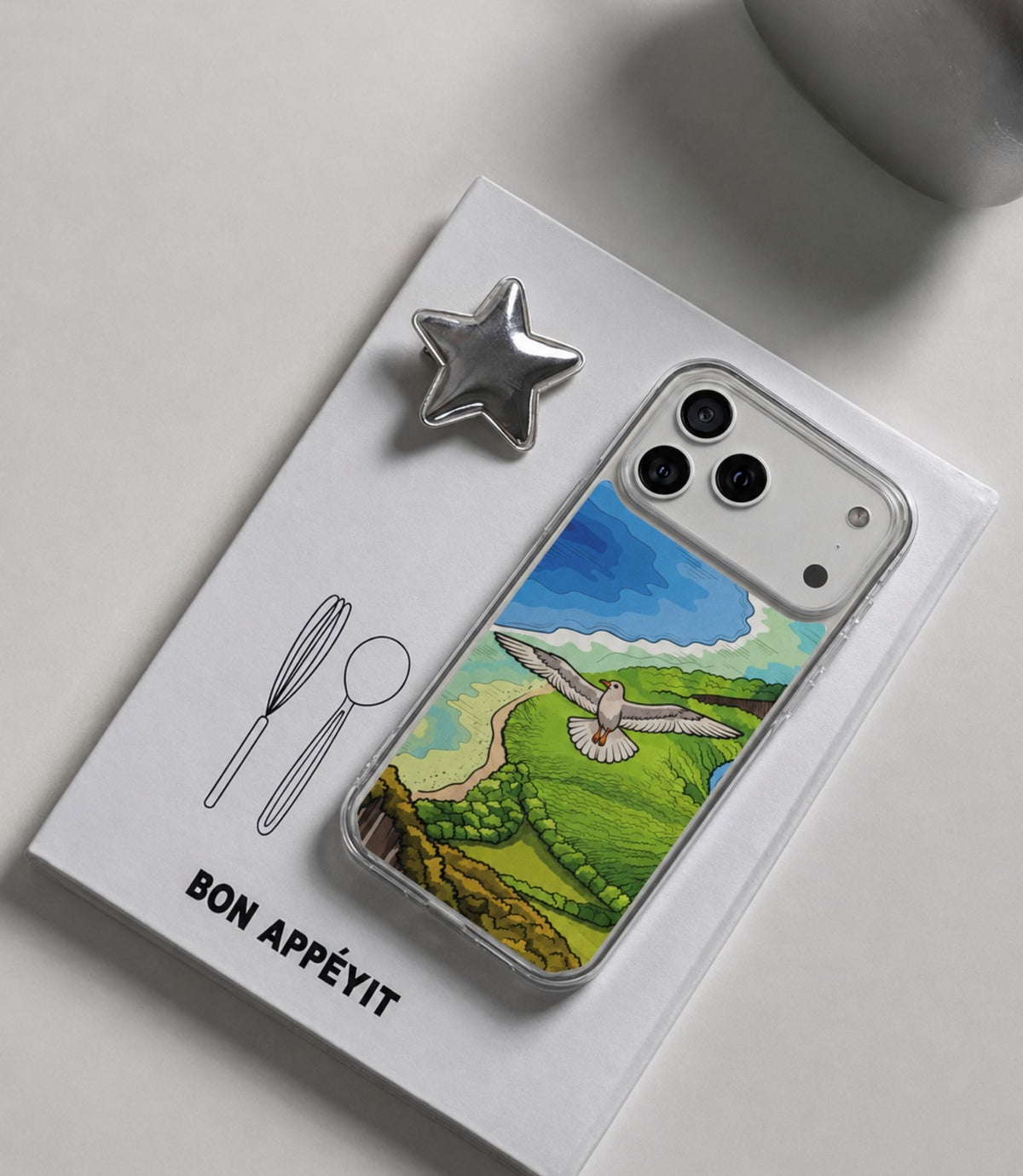 Volcanic coast and seagull clear phone case styled in an everyday lifestyle scene