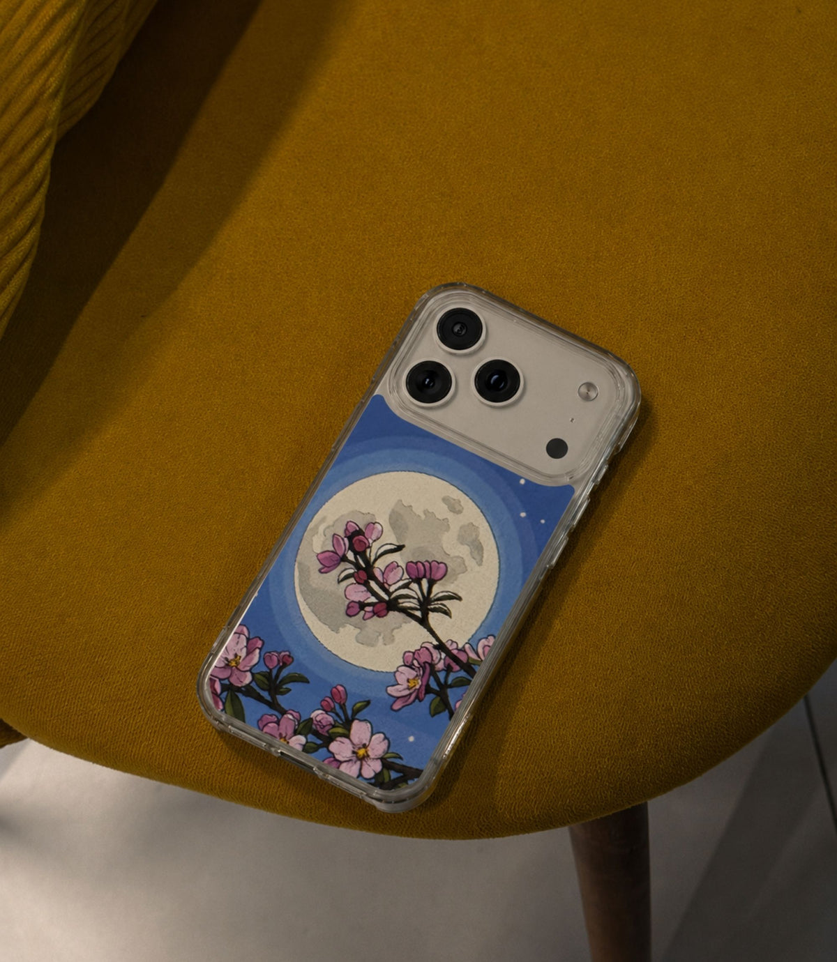 Cherry blossom moon clear phone case styled in an everyday lifestyle scene