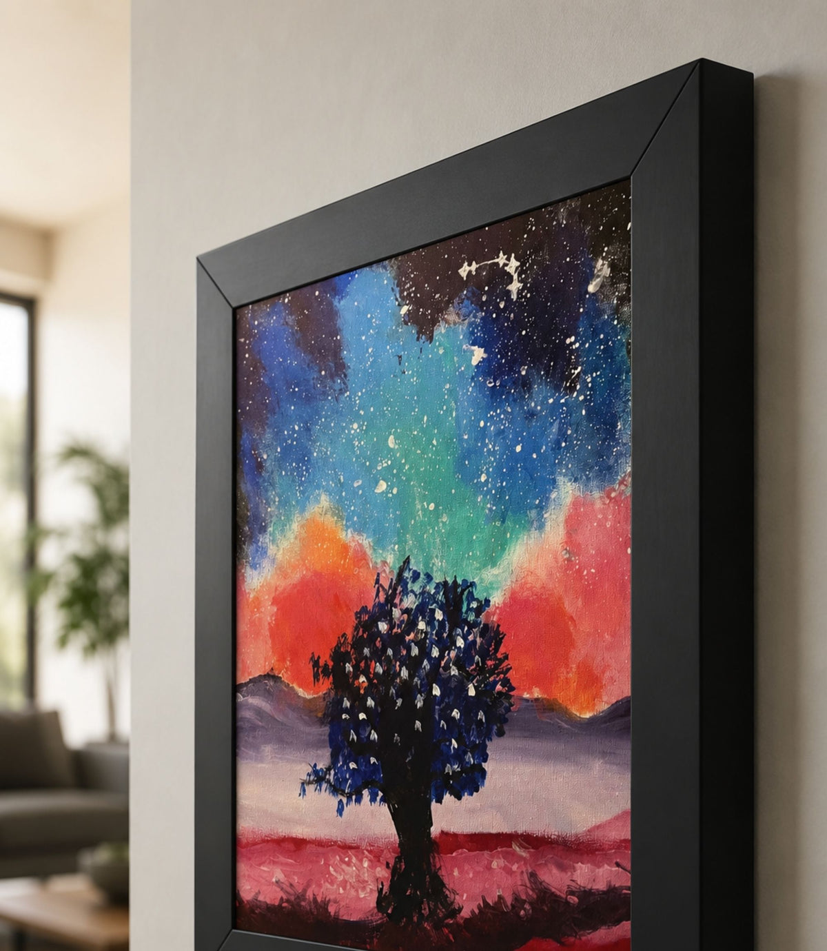 Close-up side view of black-framed galaxy tree art print