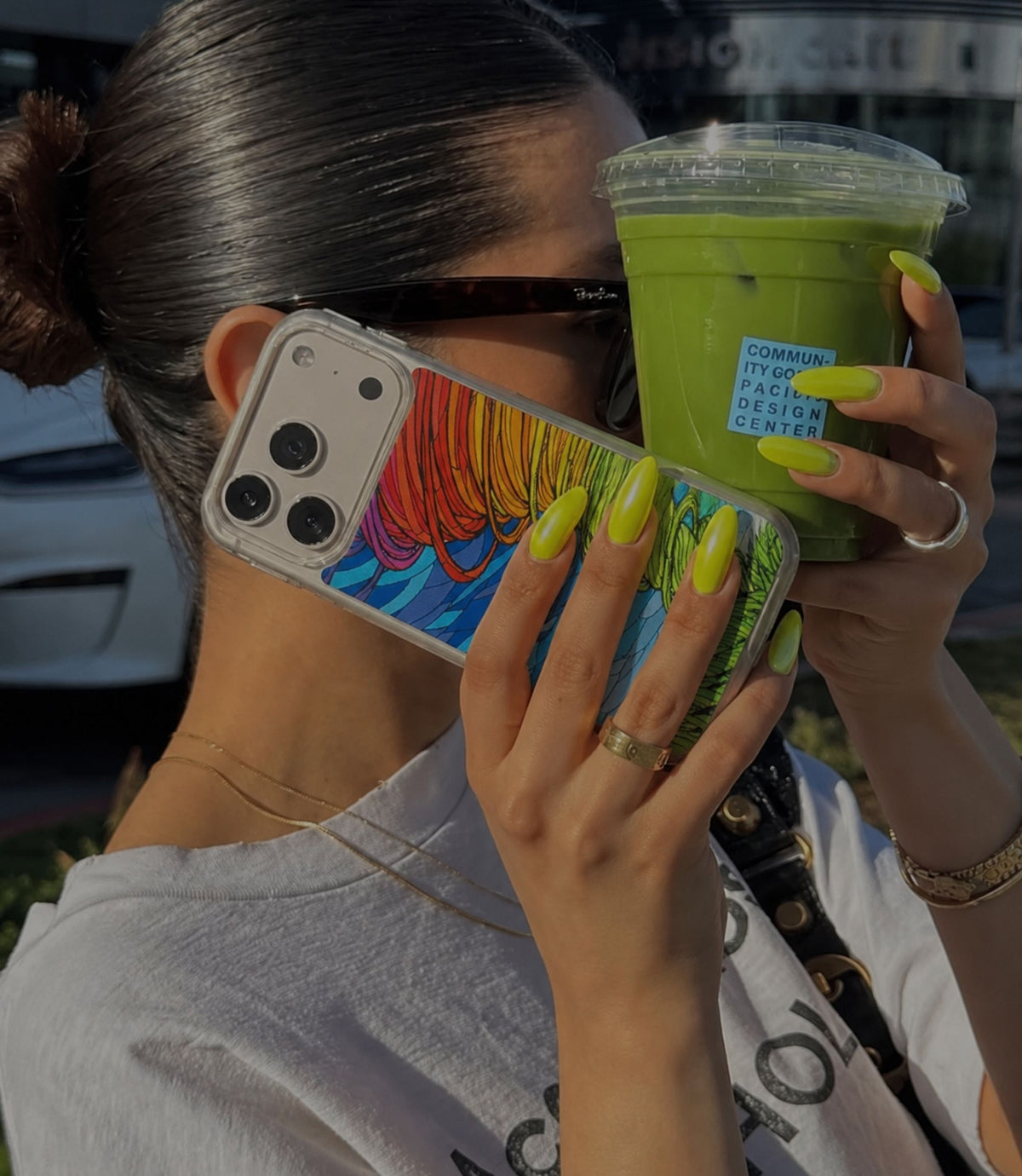 Person holding rainbow tornado clear magnetic phone case