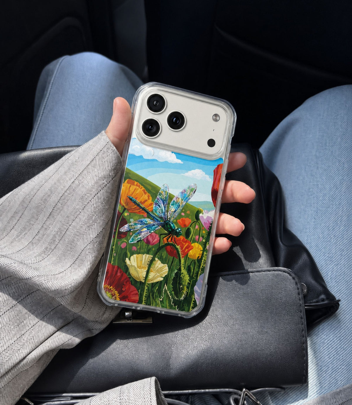 Person holding dragonfly meadow clear magnetic phone case
