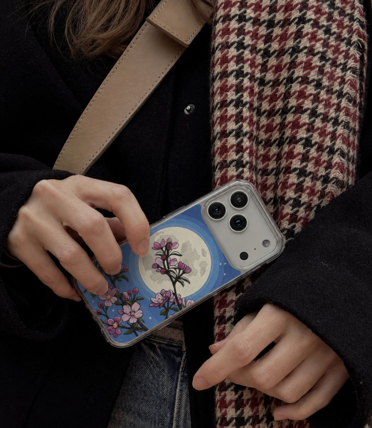 Person holding cherry blossom moon clear magnetic phone case