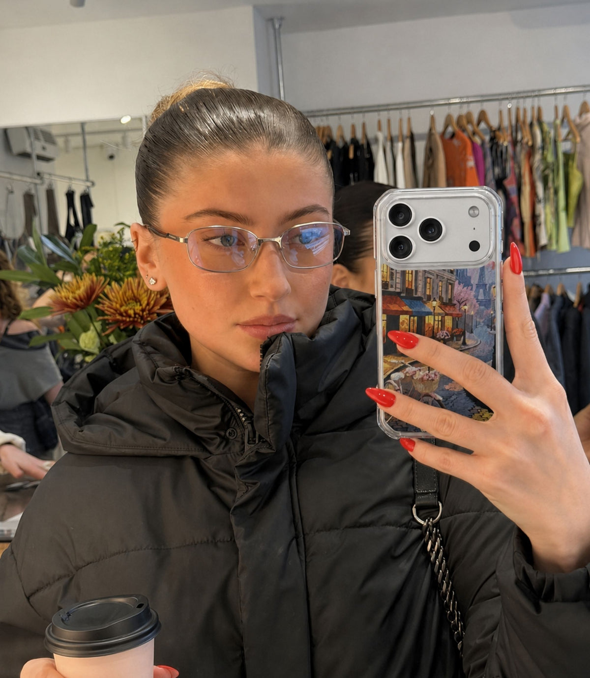 Person holding Paris street café clear magnetic phone case