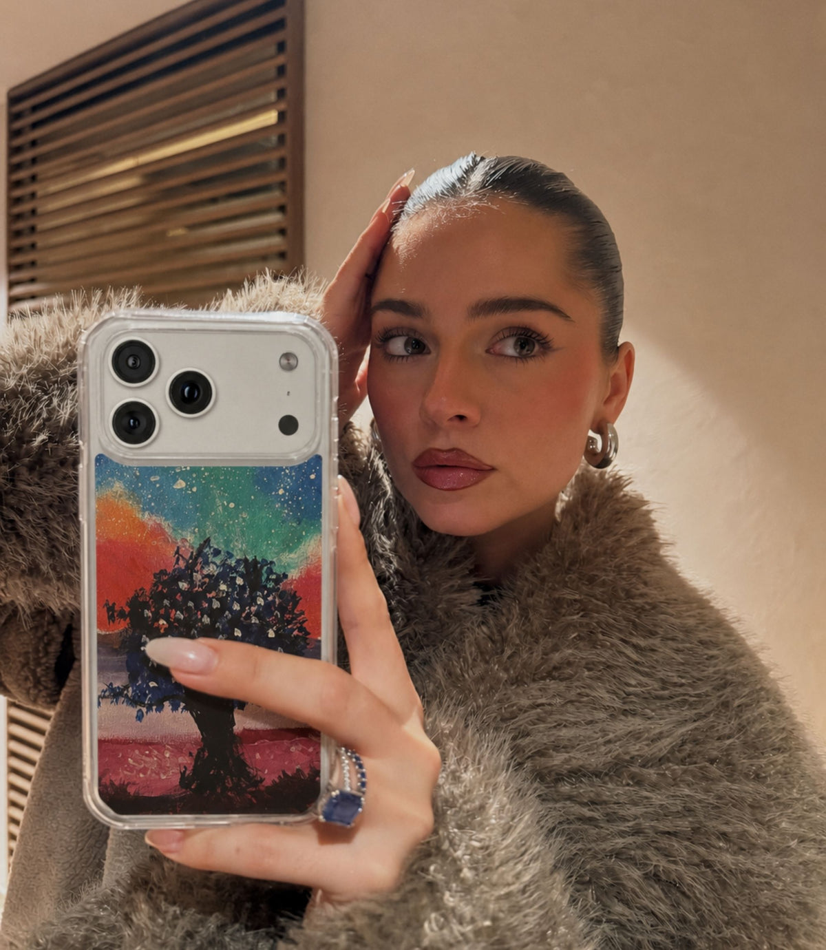 Person holding galaxy tree clear magnetic phone case