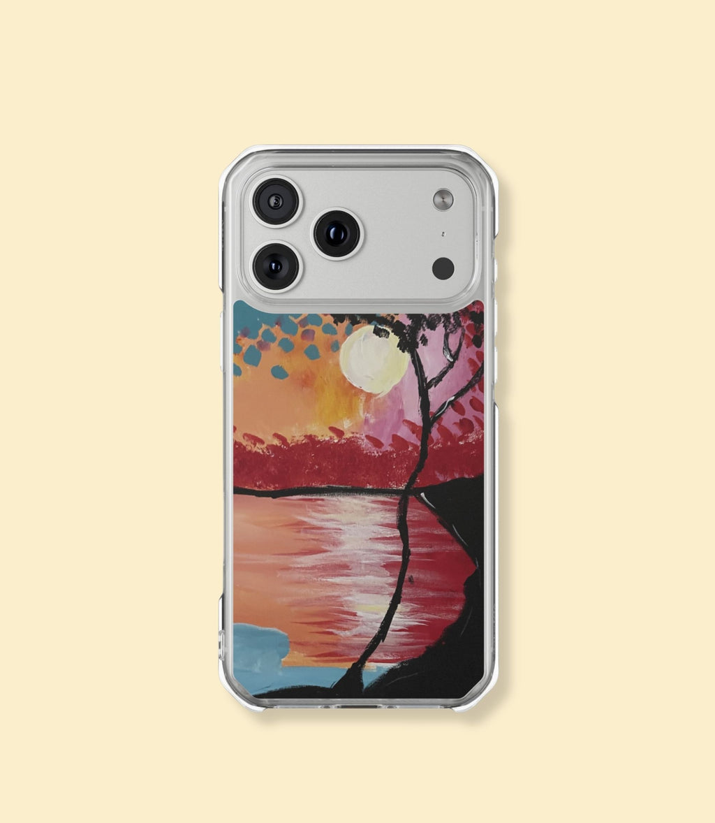 Sunset lake and silhouetted tree clear magnetic phone case for iPhone 17 Pro Max on a cream background